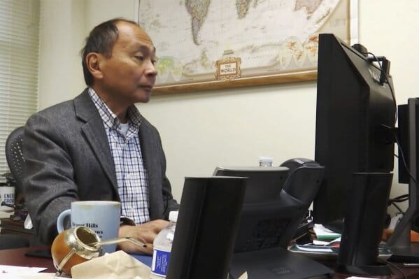 Frances Fukuyama on the computer (possibly talking to an AI chatbot?)